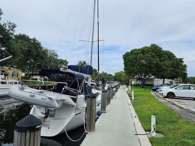 1101 River Reach Dr Unit 418, Fort Lauderdale, FL 33315 - dock featuring a lawn