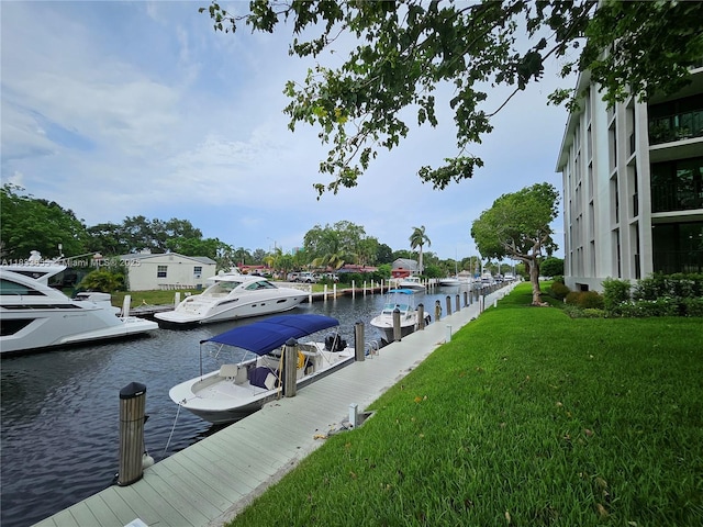 1101 River Reach Dr Unit 418, Fort Lauderdale, FL 33315 - dock area with a water view and a yard