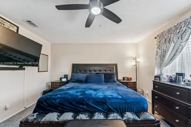 8107 NW 73rd Ter, Tamarac, FL 33321 - carpeted bedroom featuring a textured ceiling and a ceiling fan