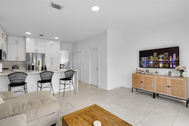 8242 NW 107th Ct Unit 7-12, Doral, FL 33178 - living area featuring arched walkways, recessed lighting, and light tile patterned floors