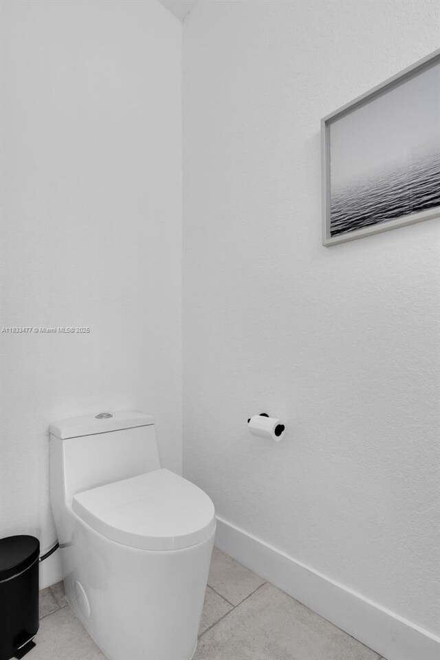 8242 NW 107th Ct Unit 7-12, Doral, FL 33178 - bathroom with toilet and tile patterned flooring