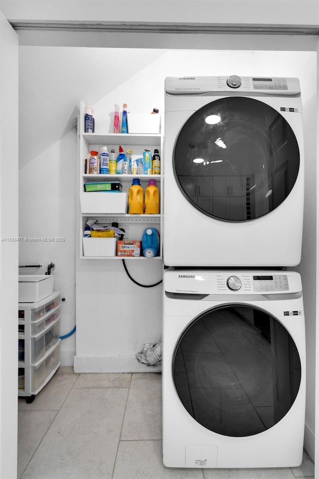 8242 NW 107th Ct Unit 7-12, Doral, FL 33178 - washroom featuring stacked washing machine and dryer and tile patterned floors