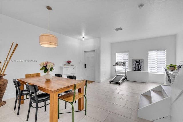 8242 NW 107th Ct Unit 7-12, Doral, FL 33178 - dining area with light tile patterned floors and baseboards