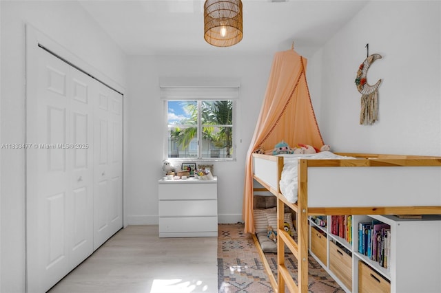 8242 NW 107th Ct Unit 7-12, Doral, FL 33178 - bedroom with wood finished floors and a closet