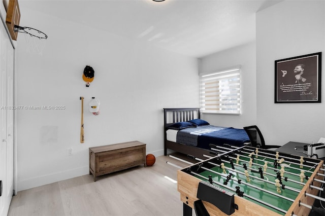 8242 NW 107th Ct Unit 7-12, Doral, FL 33178 - bedroom featuring wood finished floors and baseboards