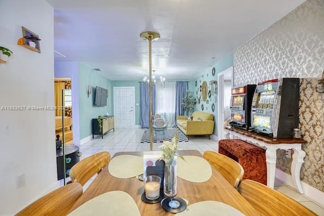 6443 Perry St, Hollywood, FL 33024 - dining room with wallpapered walls, a chandelier, and light tile patterned flooring