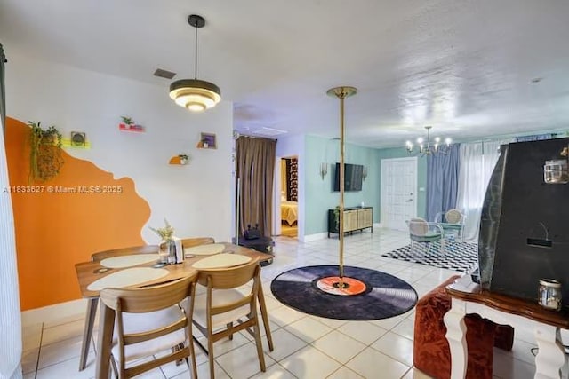 6443 Perry St, Hollywood, FL 33024 - dining space with a chandelier and light tile patterned floors