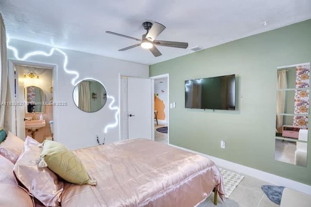 6443 Perry St, Hollywood, FL 33024 - tiled bedroom featuring ensuite bath and ceiling fan
