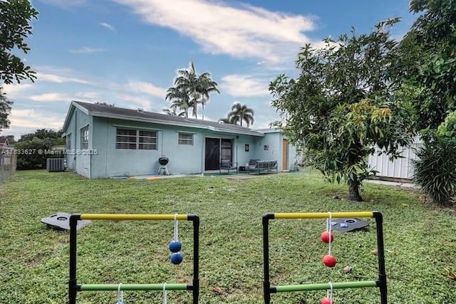 6443 Perry St, Hollywood, FL 33024 - rear view of house featuring a fenced backyard and a patio