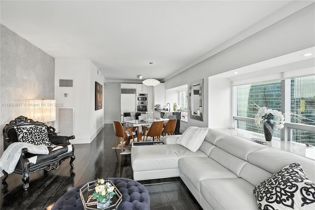1435 Brickell Ave Unit 3512, Miami, FL 33131 - living area with dark wood-style floors and baseboards