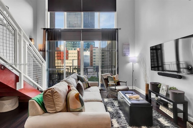 244 Biscayne Blvd Unit 440, Miami, FL 33132 - living area featuring wood finished floors, a high ceiling, and stairs