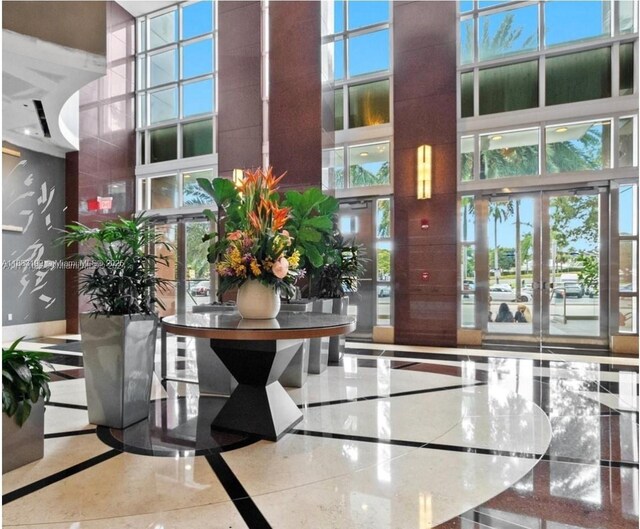 244 Biscayne Blvd Unit 440, Miami, FL 33132 - building lobby with a high ceiling
