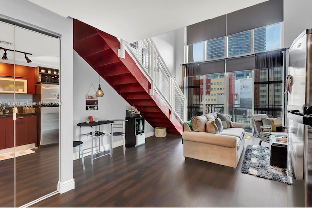 244 Biscayne Blvd Unit 440, Miami, FL 33132 - living area with wood finished floors, stairway, and track lighting