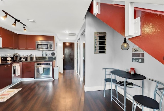 244 Biscayne Blvd Unit 440, Miami, FL 33132 - kitchen featuring appliances with stainless steel finishes, dark wood-type flooring, dark countertops, recessed lighting, and modern cabinets