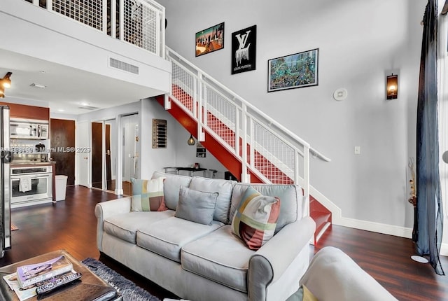 244 Biscayne Blvd Unit 440, Miami, FL 33132 - living room with stairway, wood finished floors, and a high ceiling