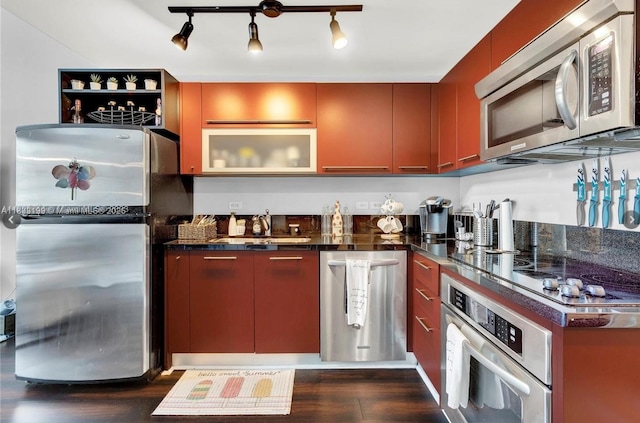 244 Biscayne Blvd Unit 440, Miami, FL 33132 - kitchen with appliances with stainless steel finishes, dark wood-type flooring, modern cabinets, and rail lighting