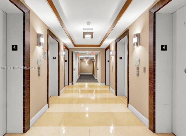 244 Biscayne Blvd Unit 440, Miami, FL 33132 - hallway featuring elevator, a raised ceiling, and light tile patterned flooring