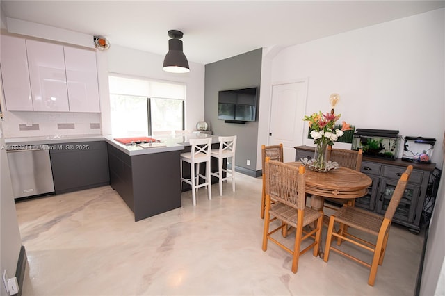 8694 Via Reale Unit 61L, Boca Raton, FL 33496 - dining area featuring concrete floors