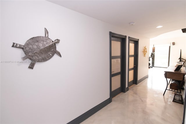 8694 Via Reale Unit 61L, Boca Raton, FL 33496 - corridor with concrete floors and baseboards