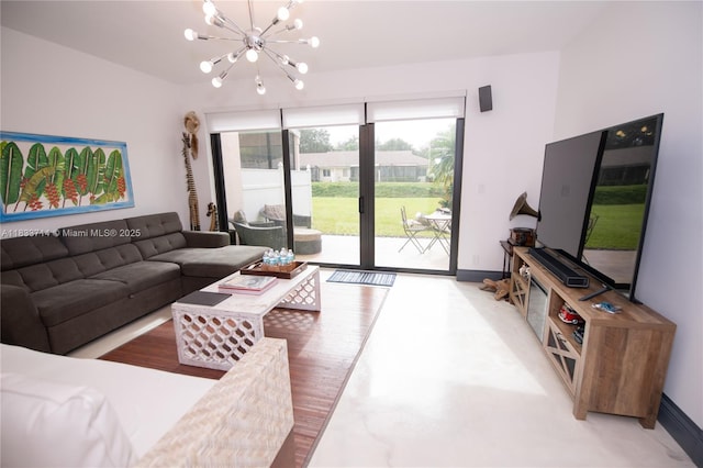 8694 Via Reale Unit 61L, Boca Raton, FL 33496 - living room featuring a chandelier and baseboards