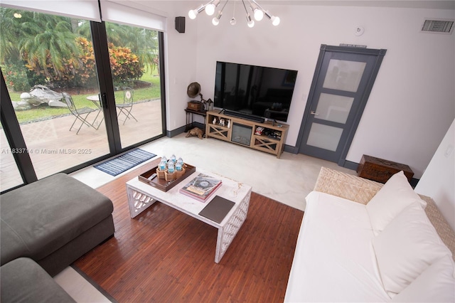 8694 Via Reale Unit 61L, Boca Raton, FL 33496 - living area with a chandelier and wood finished floors