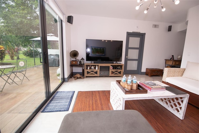 8694 Via Reale Unit 61L, Boca Raton, FL 33496 - living room with a chandelier and wood finished floors