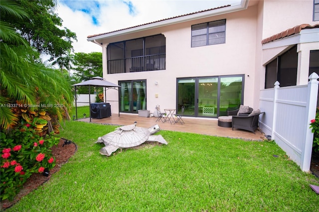 8694 Via Reale Unit 61L, Boca Raton, FL 33496 - back of house with stucco siding and a patio area