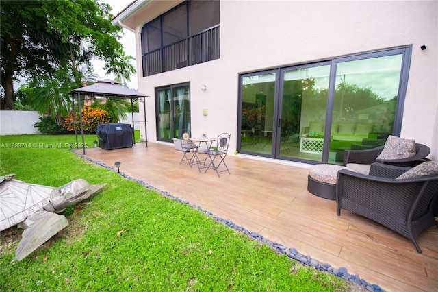 8694 Via Reale Unit 61L, Boca Raton, FL 33496 - rear view of property with stucco siding, a gazebo, and a deck