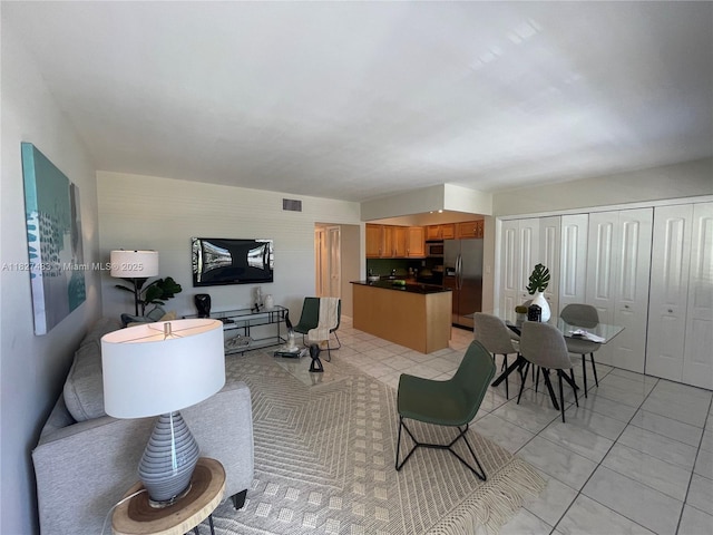 4051 NE 13th Ave Unit 55-3, Oakland Park, FL 33334 - living room featuring light tile patterned flooring