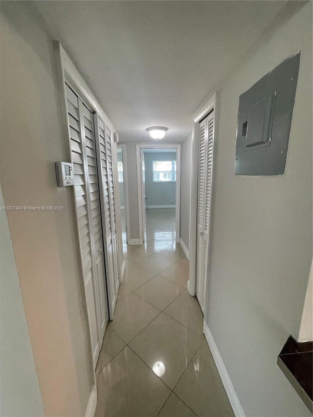 4051 NE 13th Ave Unit 55-3, Oakland Park, FL 33334 - hall with electric panel and light tile patterned flooring