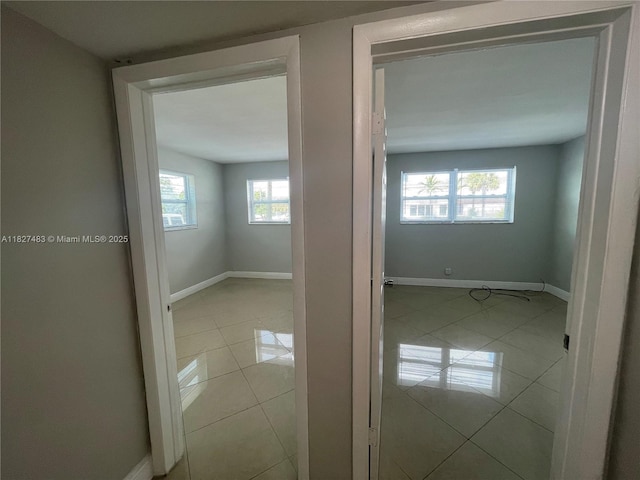 4051 NE 13th Ave Unit 55-3, Oakland Park, FL 33334 - empty room featuring light tile patterned floors and baseboards