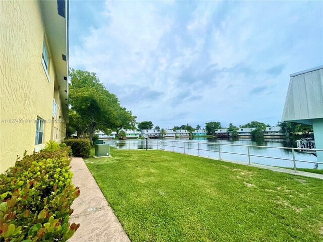 4051 NE 13th Ave Unit 55-3, Oakland Park, FL 33334 - view of green lawn featuring a water view