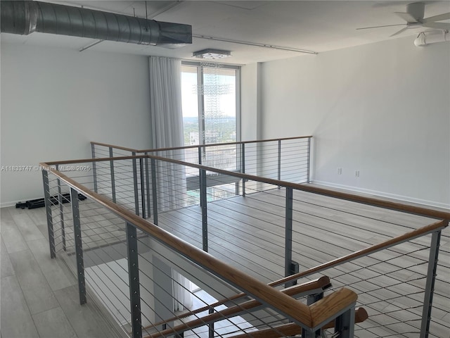 690 SW 1st Ct Unit 19, Miami, FL 33130 - hallway featuring an upstairs landing and wood finished floors