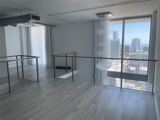 690 SW 1st Ct Unit 19, Miami, FL 33130 - unfurnished room with wood finished floors and a city view