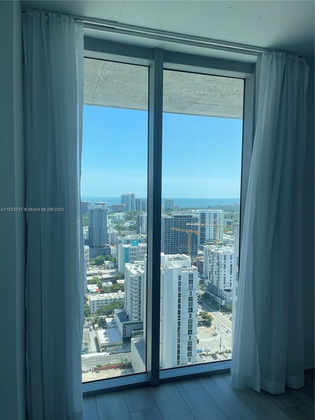 690 SW 1st Ct Unit 19, Miami, FL 33130 - doorway to outside with a view of city, plenty of natural light, and floor to ceiling windows