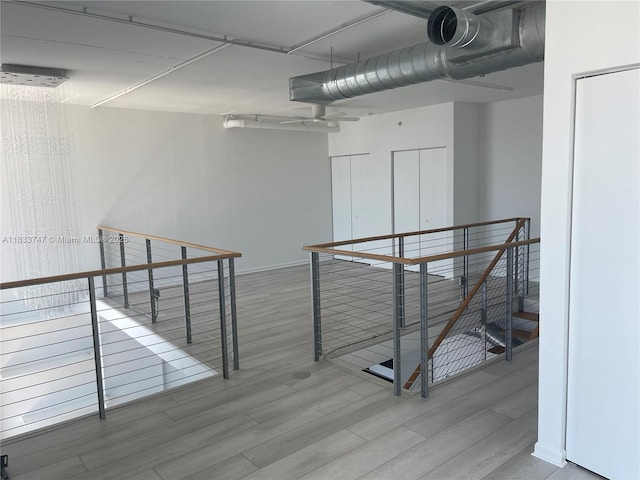 690 SW 1st Ct Unit 19, Miami, FL 33130 - hall with an upstairs landing and wood finished floors