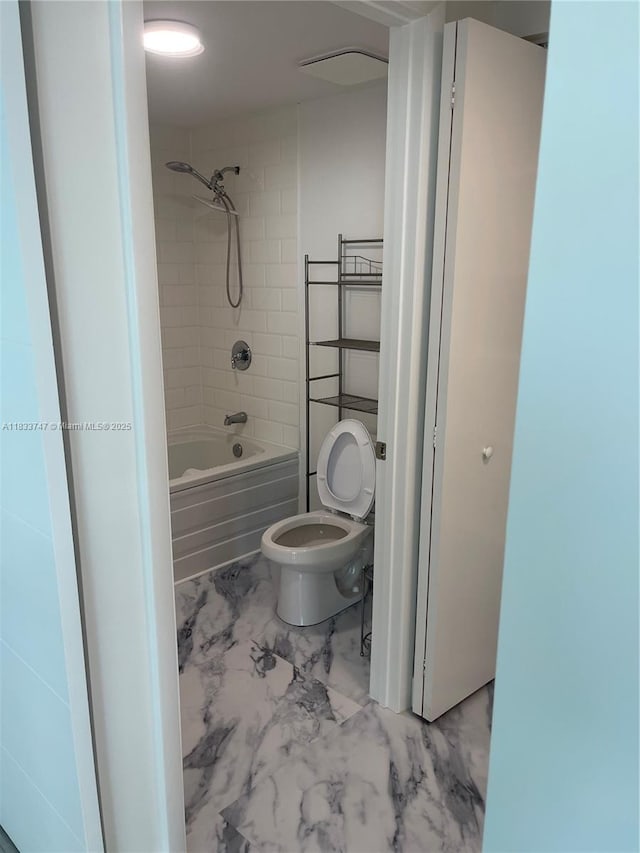 690 SW 1st Ct Unit 19, Miami, FL 33130 - full bathroom featuring marble look tiles and bathtub / shower combination
