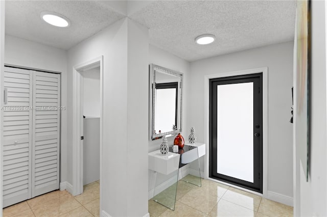 5400 NW 184th St, Miami Gardens, FL 33055 - bathroom with a closet, plenty of natural light, a textured ceiling, and tile patterned floors