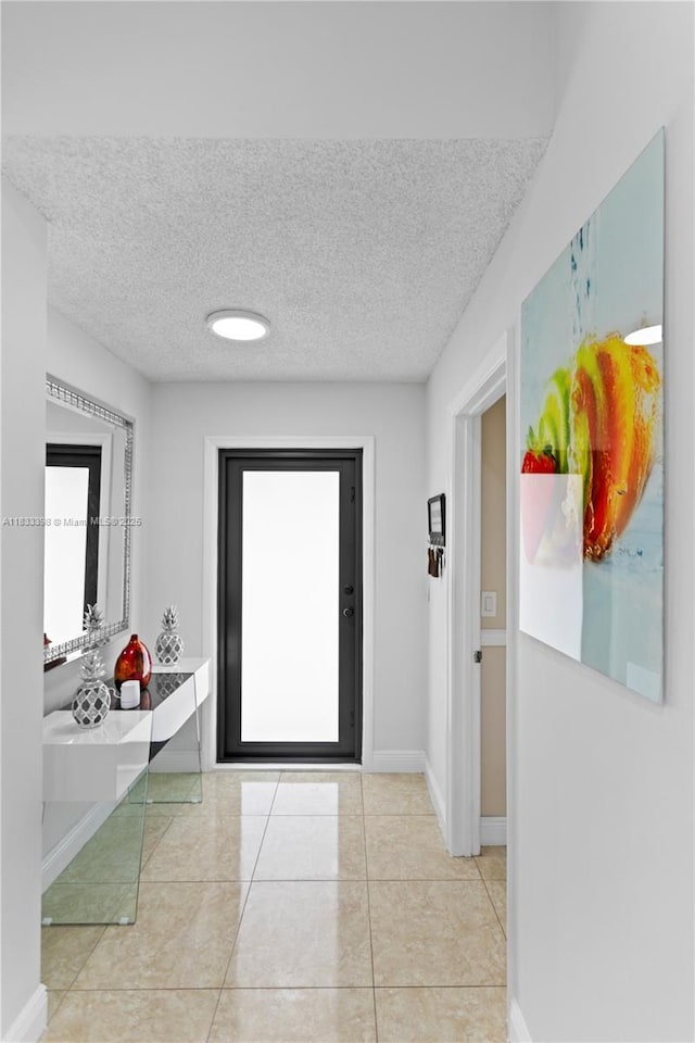 5400 NW 184th St, Miami Gardens, FL 33055 - entryway with a textured ceiling and light tile patterned flooring