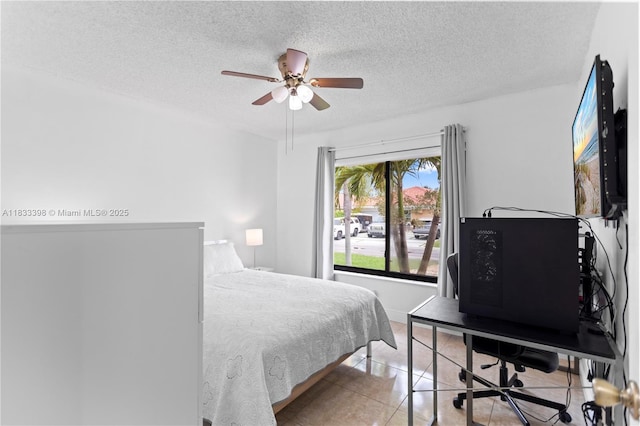 5400 NW 184th St, Miami Gardens, FL 33055 - bedroom featuring light tile patterned flooring, a textured ceiling, ceiling fan, and an office area