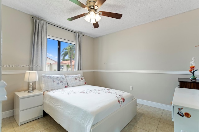 5400 NW 184th St, Miami Gardens, FL 33055 - bedroom featuring light tile patterned floors, a textured ceiling, and ceiling fan