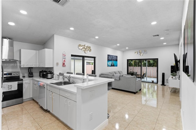 5400 NW 184th St, Miami Gardens, FL 33055 - kitchen featuring stainless steel range with electric stovetop, wall chimney range hood, a peninsula, white dishwasher, and light tile patterned floors