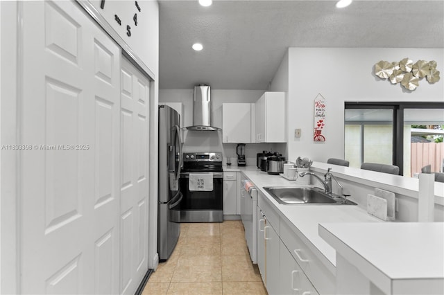 5400 NW 184th St, Miami Gardens, FL 33055 - kitchen with wall chimney exhaust hood, appliances with stainless steel finishes, light countertops, a peninsula, and recessed lighting