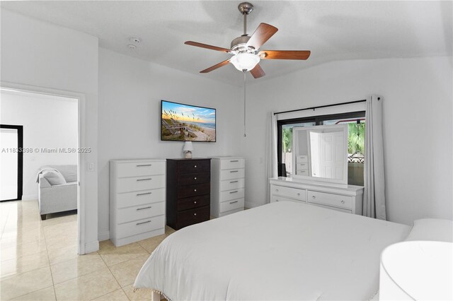5400 NW 184th St, Miami Gardens, FL 33055 - bedroom featuring light tile patterned floors, a ceiling fan, and vaulted ceiling