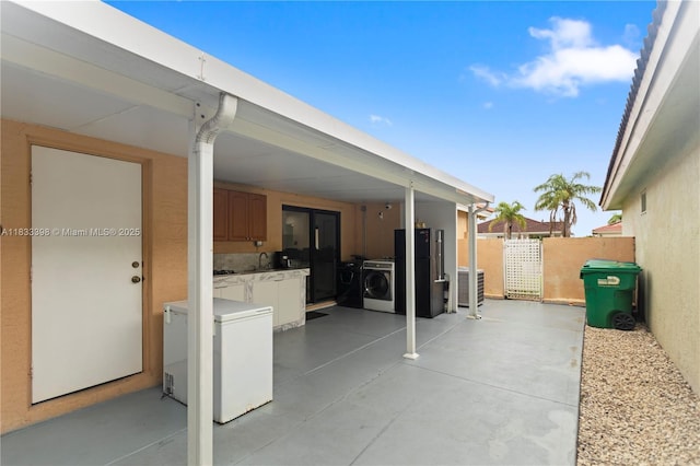 5400 NW 184th St, Miami Gardens, FL 33055 - view of patio / terrace featuring washer and clothes dryer and a sink