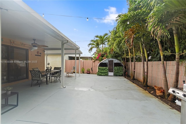 5400 NW 184th St, Miami Gardens, FL 33055 - fenced backyard with a ceiling fan, outdoor dining space, and a patio