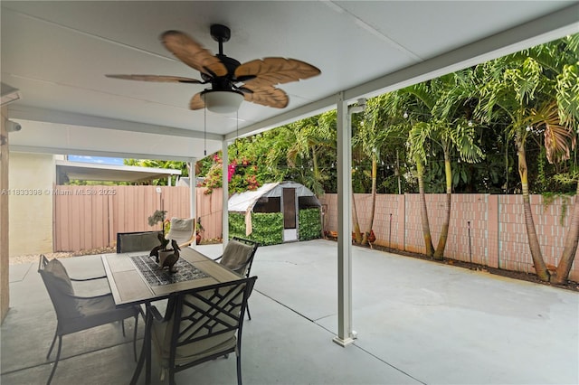 5400 NW 184th St, Miami Gardens, FL 33055 - fenced backyard featuring a patio area, a ceiling fan, outdoor dining space, and a storage shed