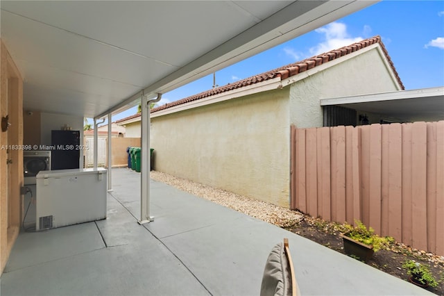 5400 NW 184th St, Miami Gardens, FL 33055 - view of patio featuring washer / dryer