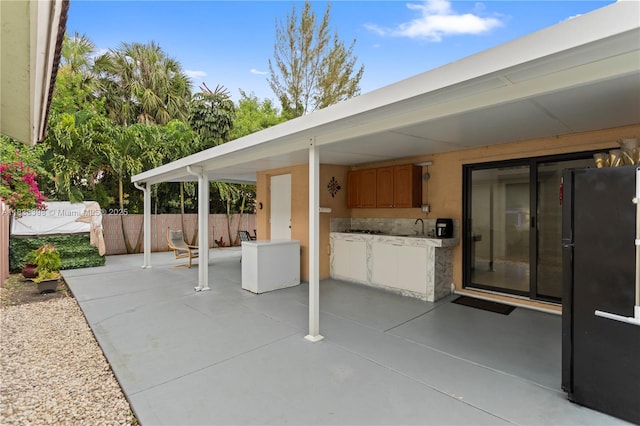 5400 NW 184th St, Miami Gardens, FL 33055 - view of patio / terrace with an outdoor kitchen and a sink