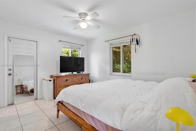 220 NW 35th Ct, Oakland Park, FL 33309 - bedroom with light tile patterned flooring and a ceiling fan